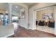 Hallway featuring wood floors, column accents, and access to a sitting room at 4134 Riva De Tierra Ln, Las Vegas, NV 89135