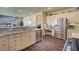 Kitchen featuring granite countertops, stainless steel appliances, and a built-in desk area at 4134 Riva De Tierra Ln, Las Vegas, NV 89135