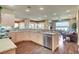 Open-concept kitchen featuring granite countertops, stainless steel appliances, and seamless access to the living area at 4134 Riva De Tierra Ln, Las Vegas, NV 89135