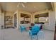 Covered patio with ample seating, ceiling fan, and view of the backyard at 4134 Riva De Tierra Ln, Las Vegas, NV 89135