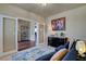 Cozy sitting room with french doors, display shelving, and comfortable seating at 4134 Riva De Tierra Ln, Las Vegas, NV 89135