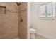 Updated bathroom featuring tiled shower with designer accents at 4573 Plaza De Vista St, Las Vegas, NV 89120