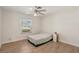 Bedroom featuring a ceiling fan and a window looking out to the neighborhood at 4573 Plaza De Vista St, Las Vegas, NV 89120