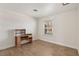 Bedroom with tile floors, small desk, and bright window view at 4573 Plaza De Vista St, Las Vegas, NV 89120