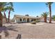 Charming single-story home with desert landscaping and mature palm trees at 4573 Plaza De Vista St, Las Vegas, NV 89120