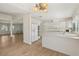 Bright kitchen with white appliances, breakfast bar, and tile floors at 4573 Plaza De Vista St, Las Vegas, NV 89120