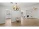 Spacious living room with neutral walls, tiled floors, and chandelier at 4573 Plaza De Vista St, Las Vegas, NV 89120
