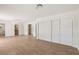 Living room featuring wood-look floors and views into other rooms at 4573 Plaza De Vista St, Las Vegas, NV 89120