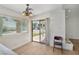Living space with sliding door, tile floors, and access to the backyard at 4573 Plaza De Vista St, Las Vegas, NV 89120