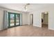 Main bedroom features wood-look floors, double doors, and access to the backyard at 4573 Plaza De Vista St, Las Vegas, NV 89120