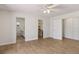 Main bedroom featuring wood-look floors, closet, and access to the bathroom at 4573 Plaza De Vista St, Las Vegas, NV 89120