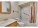 Cozy bathroom featuring a shower and tub combo and vanity with storage at 4765 N Grand Canyon Dr, Las Vegas, NV 89129