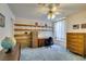 Bedroom with built-in shelving and a ceiling fan for added comfort and convenience at 4765 N Grand Canyon Dr, Las Vegas, NV 89129