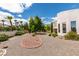 Expansive desert landscaped backyard featuring gravel, decorative rock, palm trees, and mature landscaping at 4765 N Grand Canyon Dr, Las Vegas, NV 89129