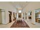 Grand foyer featuring tile flooring, high ceilings, and a decorative chandelier at 4765 N Grand Canyon Dr, Las Vegas, NV 89129