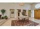 Large foyer with tiled floors, a decorative rug, chandelier lighting, and access to other rooms at 4765 N Grand Canyon Dr, Las Vegas, NV 89129