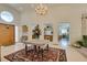Bright foyer with high ceilings, tile floors, and a view into the open kitchen at 4765 N Grand Canyon Dr, Las Vegas, NV 89129