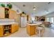 Bright kitchen featuring a breakfast bar with seating and built in appliances at 4765 N Grand Canyon Dr, Las Vegas, NV 89129