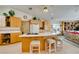 Bright open kitchen featuring a breakfast bar with seating and built in appliances at 4765 N Grand Canyon Dr, Las Vegas, NV 89129