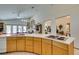 Bright kitchen featuring a breakfast bar with seating and views into the living area at 4765 N Grand Canyon Dr, Las Vegas, NV 89129