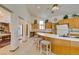Open kitchen features a breakfast bar with seating and ample cabinet space at 4765 N Grand Canyon Dr, Las Vegas, NV 89129