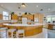 Bright kitchen features a breakfast bar with seating and ample cabinet space at 4765 N Grand Canyon Dr, Las Vegas, NV 89129