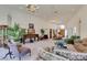 Large living room featuring a baby grand piano, expansive windows, and views of the foyer at 4765 N Grand Canyon Dr, Las Vegas, NV 89129