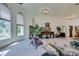 Bright living room with large windows, high ceilings, and a piano at 4765 N Grand Canyon Dr, Las Vegas, NV 89129