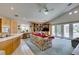 Vaulted living room boasting built-in shelves and a view of the backyard at 4765 N Grand Canyon Dr, Las Vegas, NV 89129