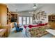 Living area with vaulted ceiling, built-in bookshelves, and backyard access at 4765 N Grand Canyon Dr, Las Vegas, NV 89129