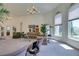 Open living room with views to kitchen, large windows offering an abundance of natural light at 4765 N Grand Canyon Dr, Las Vegas, NV 89129