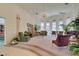 Spacious living room with high ceilings, large windows, and comfortable seating at 4765 N Grand Canyon Dr, Las Vegas, NV 89129
