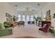 Elegant living room with a piano, plush seating, and plenty of natural light at 4765 N Grand Canyon Dr, Las Vegas, NV 89129