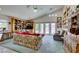 Bright living room featuring a ceiling fan and access to the backyard at 4765 N Grand Canyon Dr, Las Vegas, NV 89129