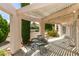 This covered patio has comfortable seating, perfect for enjoying the outdoor views at 4765 N Grand Canyon Dr, Las Vegas, NV 89129