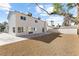 Backyard featuring desert landscaping, tall palm trees, storage shed, and back of home at 5035 Meadow Grove Ct, Las Vegas, NV 89120