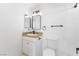 Well-lit bathroom featuring modern fixtures, vanity, and a neutral color scheme at 5035 Meadow Grove Ct, Las Vegas, NV 89120