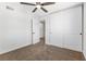 Bedroom featuring carpet, ceiling fan, closet, and an entrance to the bathroom at 5035 Meadow Grove Ct, Las Vegas, NV 89120