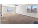 Bright bedroom with a ceiling fan and large windows, offering ample natural light at 5035 Meadow Grove Ct, Las Vegas, NV 89120