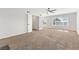 Bright bedroom with a ceiling fan and large windows for ample natural light at 5035 Meadow Grove Ct, Las Vegas, NV 89120