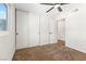 Bedroom featuring a large window and closet with sliding doors, providing ample storage at 5035 Meadow Grove Ct, Las Vegas, NV 89120