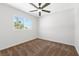 Carpeted bedroom with window providing natural light and a ceiling fan at 5035 Meadow Grove Ct, Las Vegas, NV 89120