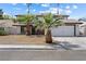 Charming two-story home with mature palm trees and a well-maintained yard at 5035 Meadow Grove Ct, Las Vegas, NV 89120