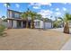 Inviting two-story home featuring desert landscaping and a spacious two-car garage at 5035 Meadow Grove Ct, Las Vegas, NV 89120
