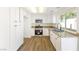 Well-lit kitchen featuring new stainless steel appliances and granite countertops at 5035 Meadow Grove Ct, Las Vegas, NV 89120