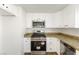A well-equipped kitchen with stainless steel appliances and granite countertops at 5035 Meadow Grove Ct, Las Vegas, NV 89120