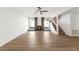 Spacious living room with hardwood floors, a fireplace, and staircase at 5035 Meadow Grove Ct, Las Vegas, NV 89120