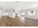 Open floor plan with new floors, modern lighting, and access to the kitchen and backyard at 5035 Meadow Grove Ct, Las Vegas, NV 89120