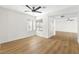 Open living space featuring hardwood floors and large windows, allowing ample natural light and views at 5035 Meadow Grove Ct, Las Vegas, NV 89120