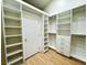 Open closet featuring floor to ceiling shelving surrounding a door to a bedroom at 5512 Oakwood Ridge St, Las Vegas, NV 89130